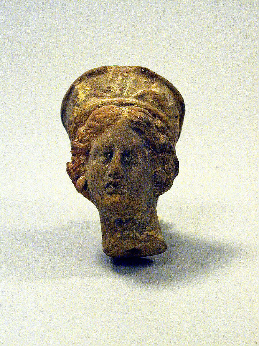 Head of a woman from a statuette, Terracotta, Greek, Asia Minor 