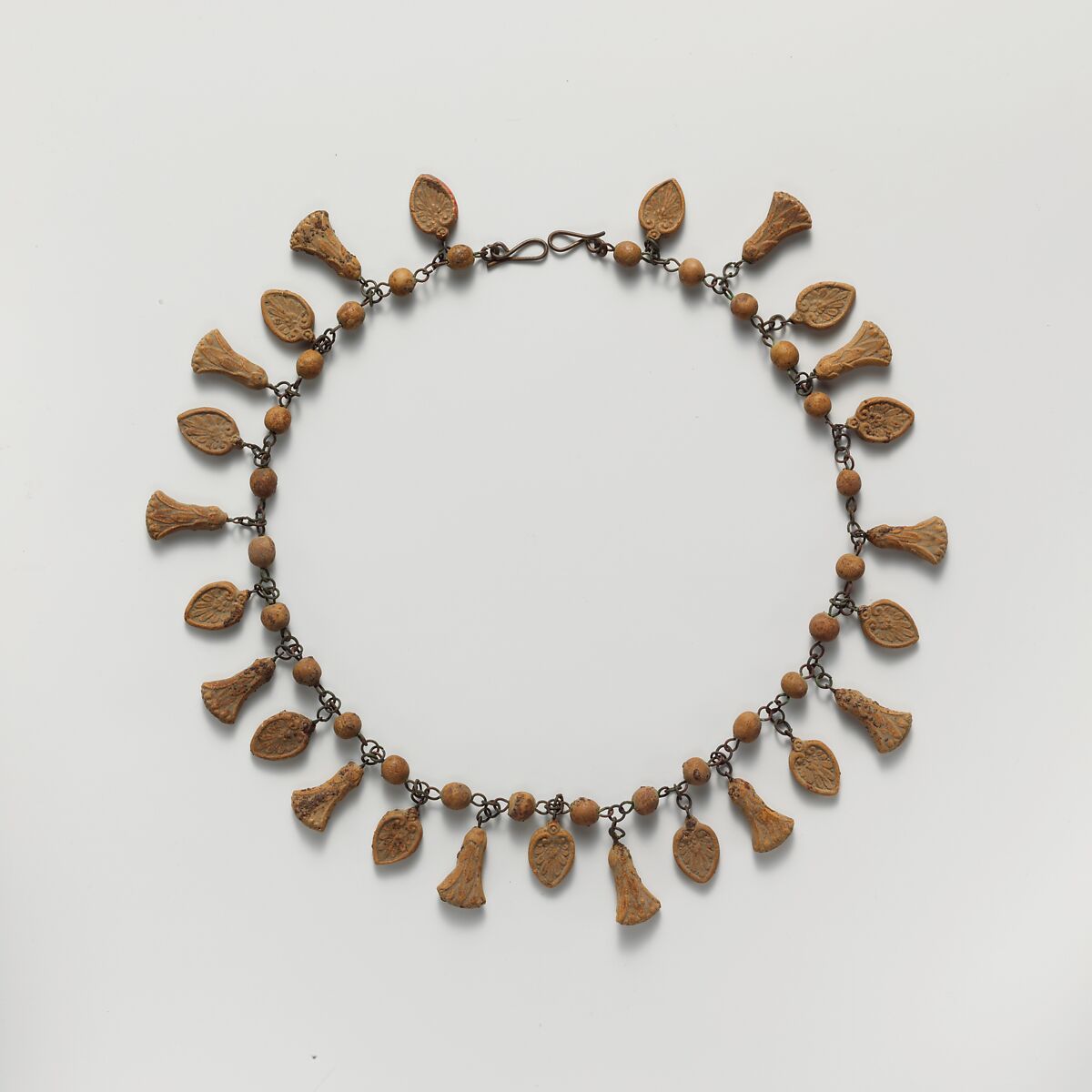 Terracotta necklace with palmette and lotus pendants, Terracotta, Etruscan 