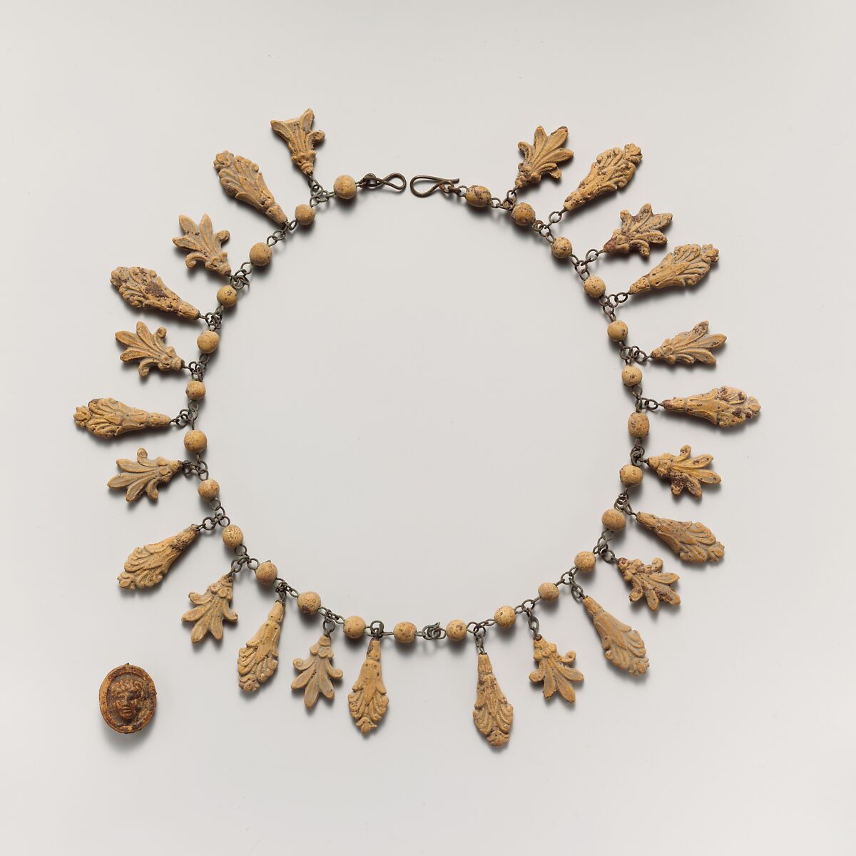 Terracotta necklace with palmette and lotus pendants, Terracotta, Etruscan 