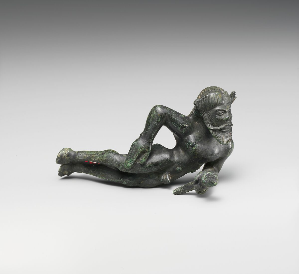 Bronze statuette of a reclining satyr, Bronze, Etruscan 