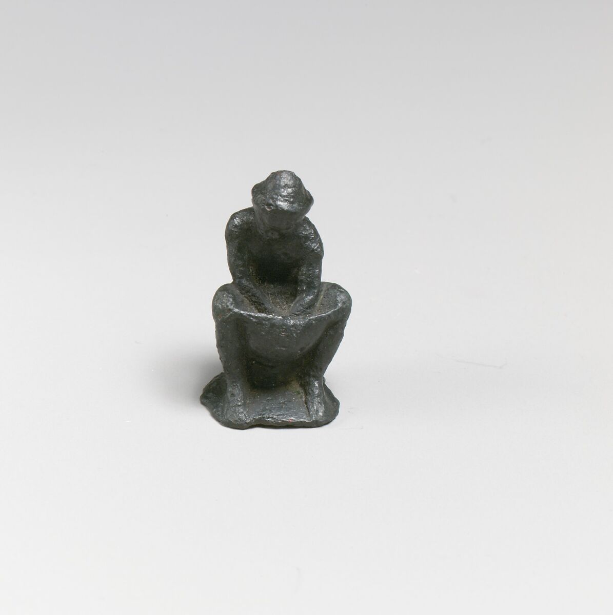 Bronze statuette of a man working, Bronze, Greek 