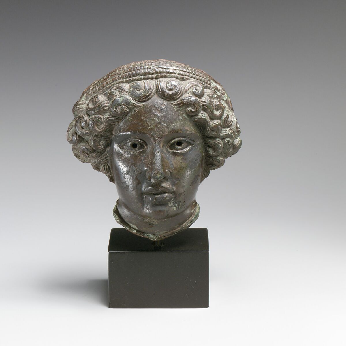 Bronze relief of the head of a woman, Bronze, Greek or Roman 