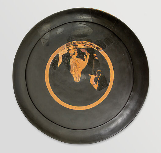 Fragmentary terracotta kylix (drinking cup)