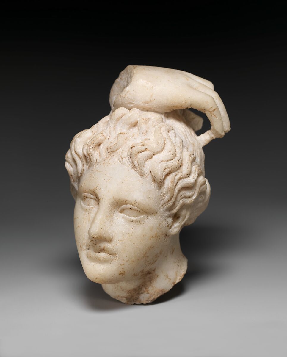 Marble head of Apollo with fragment of his hand, Marble, Roman