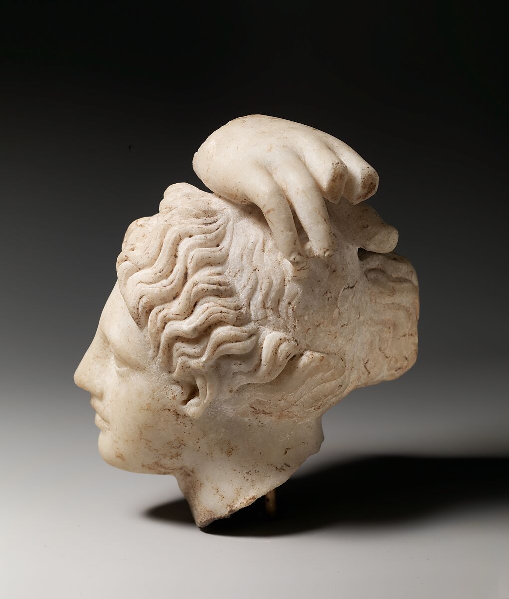 Marble head of Apollo with fragment of his hand, Marble, Roman