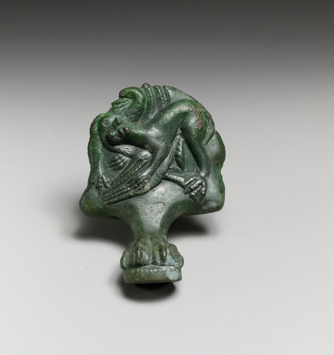 Pair of bronze cista (toiletries box) feet with panthers attacking cranes, Bronze, Praenestine