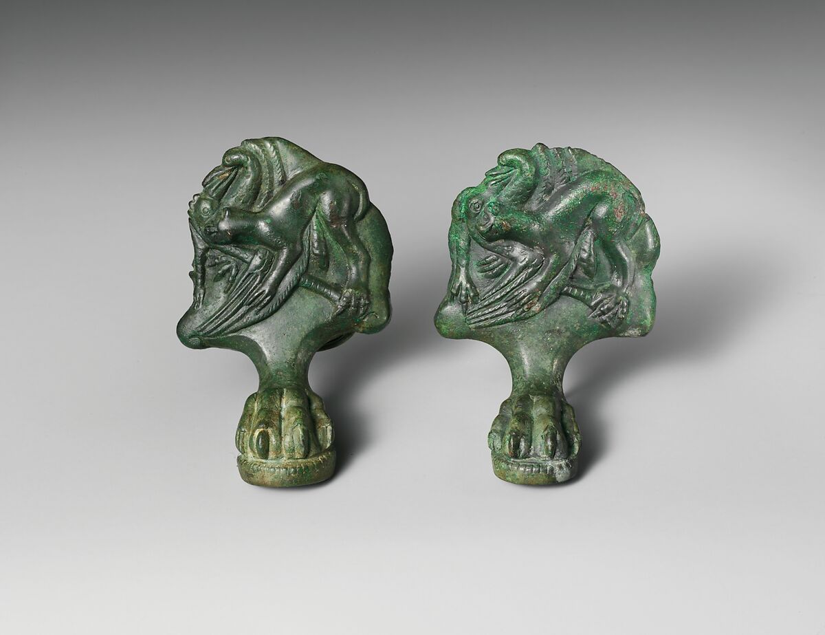 Pair of bronze cista (toiletries box) feet with panthers attacking cranes, Bronze, Praenestine 