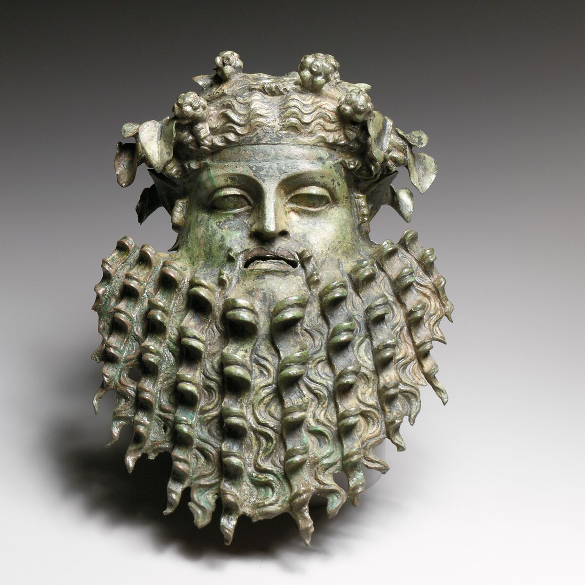 Bronze handle attachment in the form of a mask, Bronze, Greek or Roman
