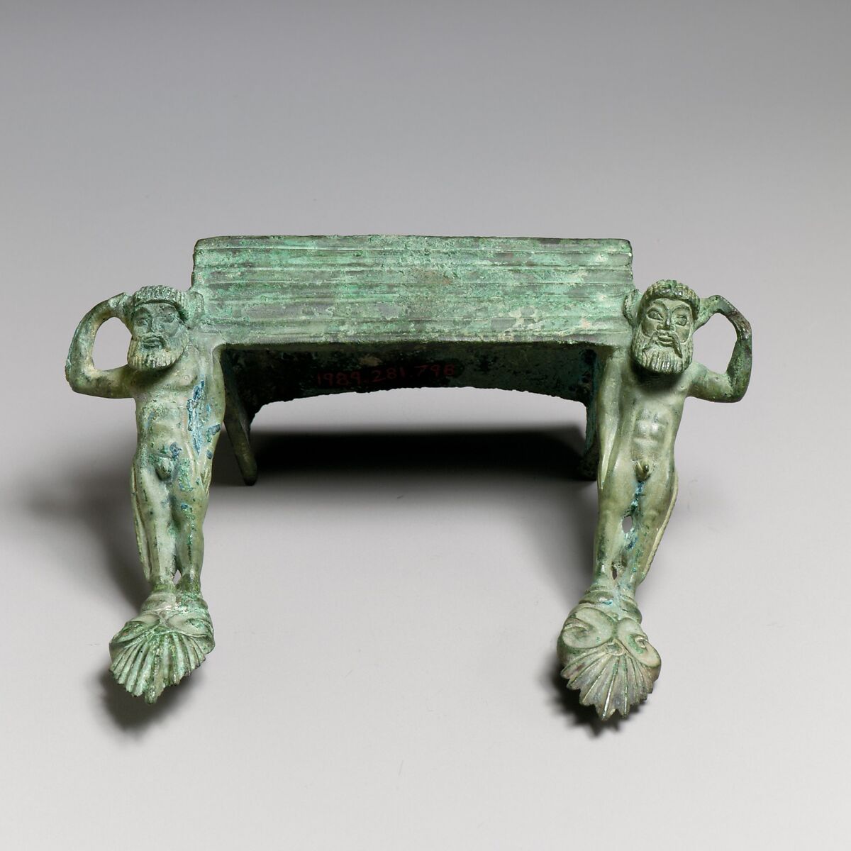 Pair of bronze handles with satyrs, Bronze, Etruscan