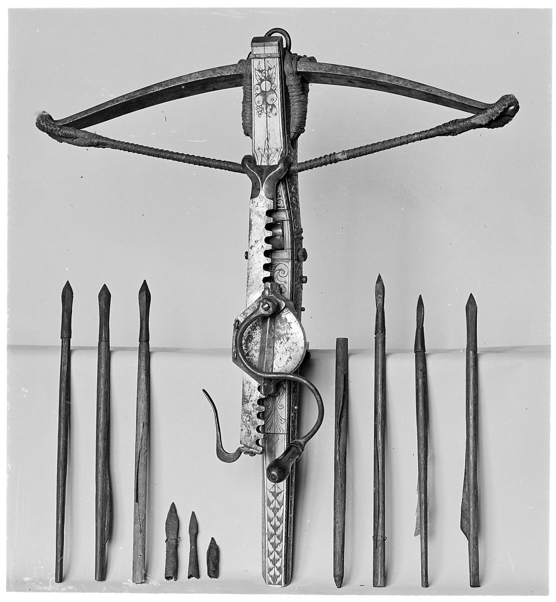 Crossbow, Cranequin and Six Crossbow Bolts, Steel, wood (probably cherry, and possibly service tree), ivory (probably elephant), horn, mother-of-pearl, iron alloy, copper alloy, hemp, southern German or Tyrolese; cranequin probably German or Swiss