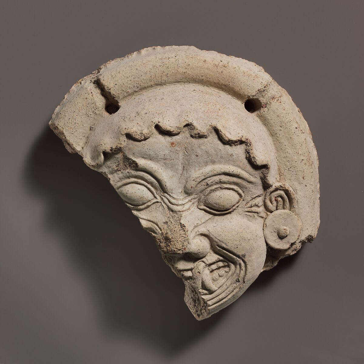 Antefix, Gorgoneion, Terracotta, Etruscan or South Italian 