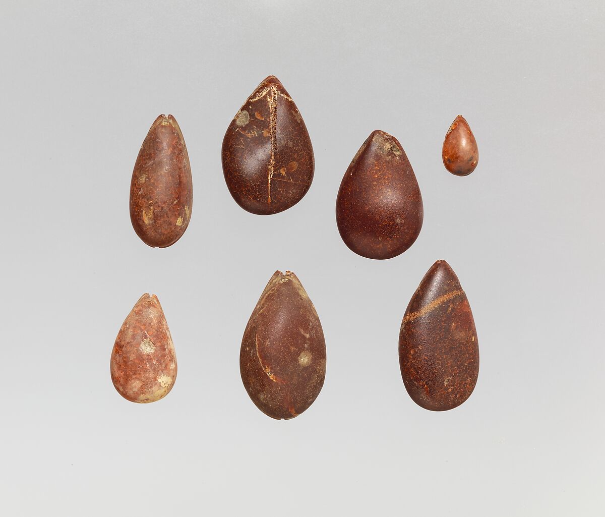 Pendants: cowrie shells, Amber, Italic 