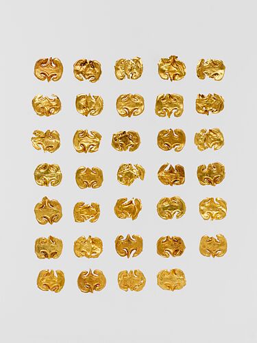 Thirty-four gold dress ornaments