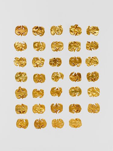 Thirty-four gold dress ornaments