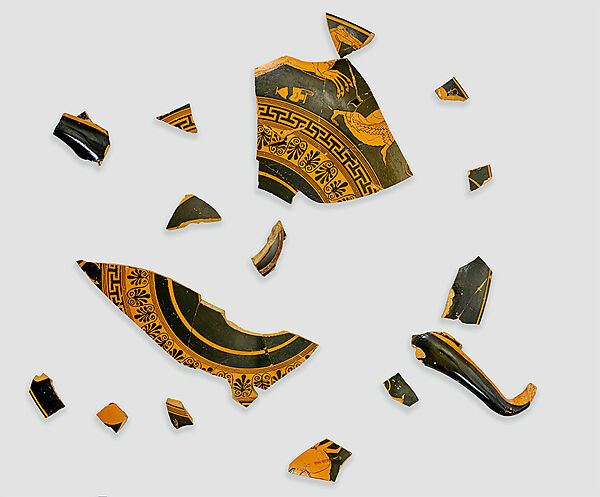 Fragments of a terracotta kylix (drinking cup), bilingual