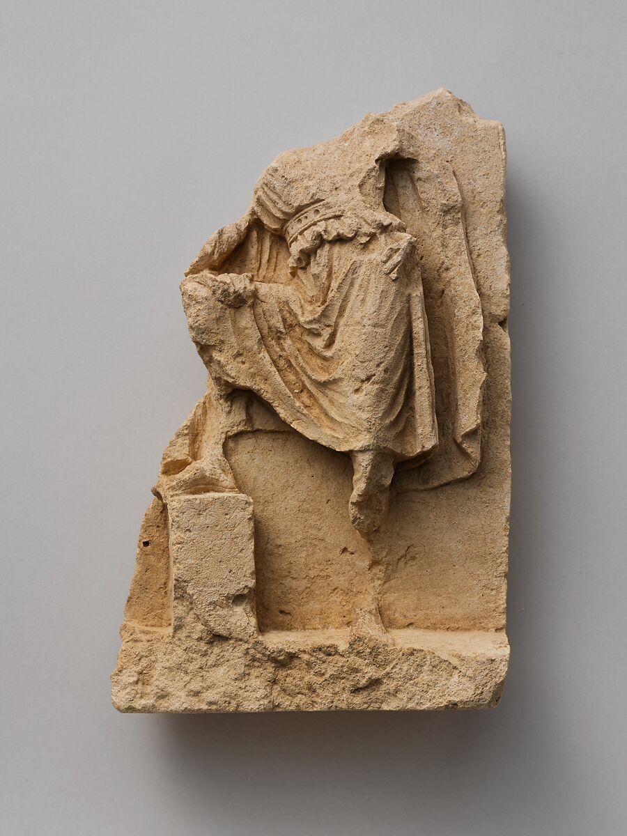 Fragment of a limestone relief with standing figure, Limestone, Greek, South Italian, Tarentine 