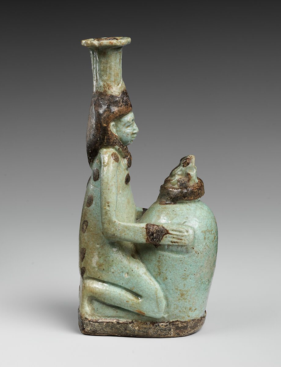 Faience double-spouted vessel in the form of a kneeling woman holding a jar, Faience, East Greek