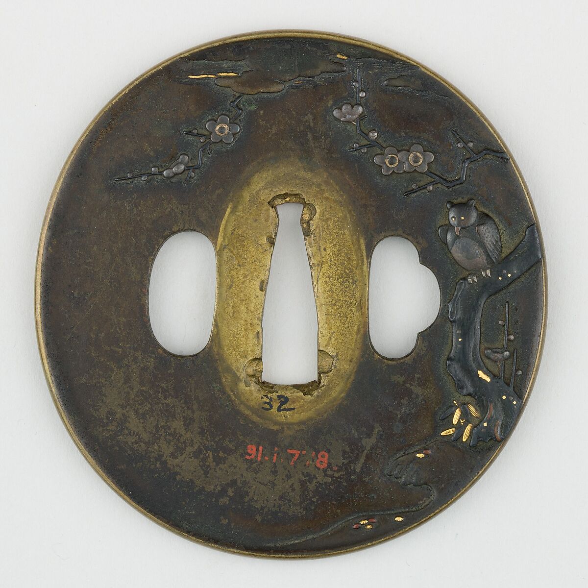 Sword Guard (<i>Tsuba</i>) Depicting Horned Owl in Plum Tree (梅樹に木菟図鐔), Brass, copper-gold alloy (shakudō), gold, silver, copper, Japanese 