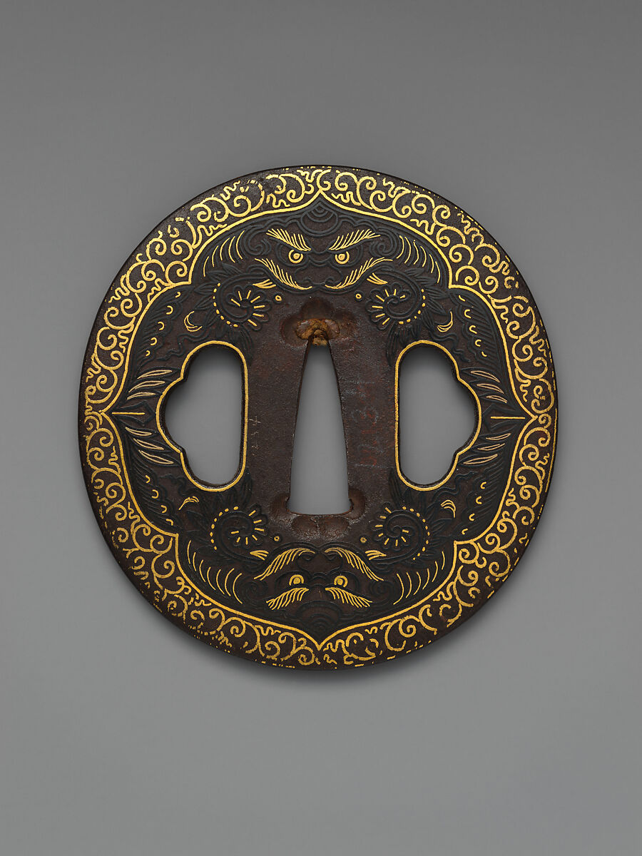 Sword Guard (<i>Tsuba</i>) Depicting Biting Lion Heads (<i>Shikami</i>) and Arabesques (獅噛唐草図南蛮鐔), Iron, gold, copper-gold alloy (<i>shakudō</i>), Japanese