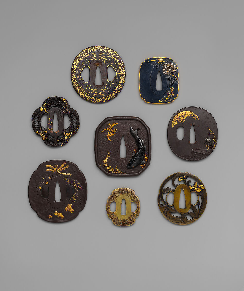 Sword Guard (<i>Tsuba</i>) Depicting Biting Lion Heads (<i>Shikami</i>) and Arabesques (獅噛唐草図南蛮鐔), Iron, gold, copper-gold alloy (<i>shakudō</i>), Japanese
