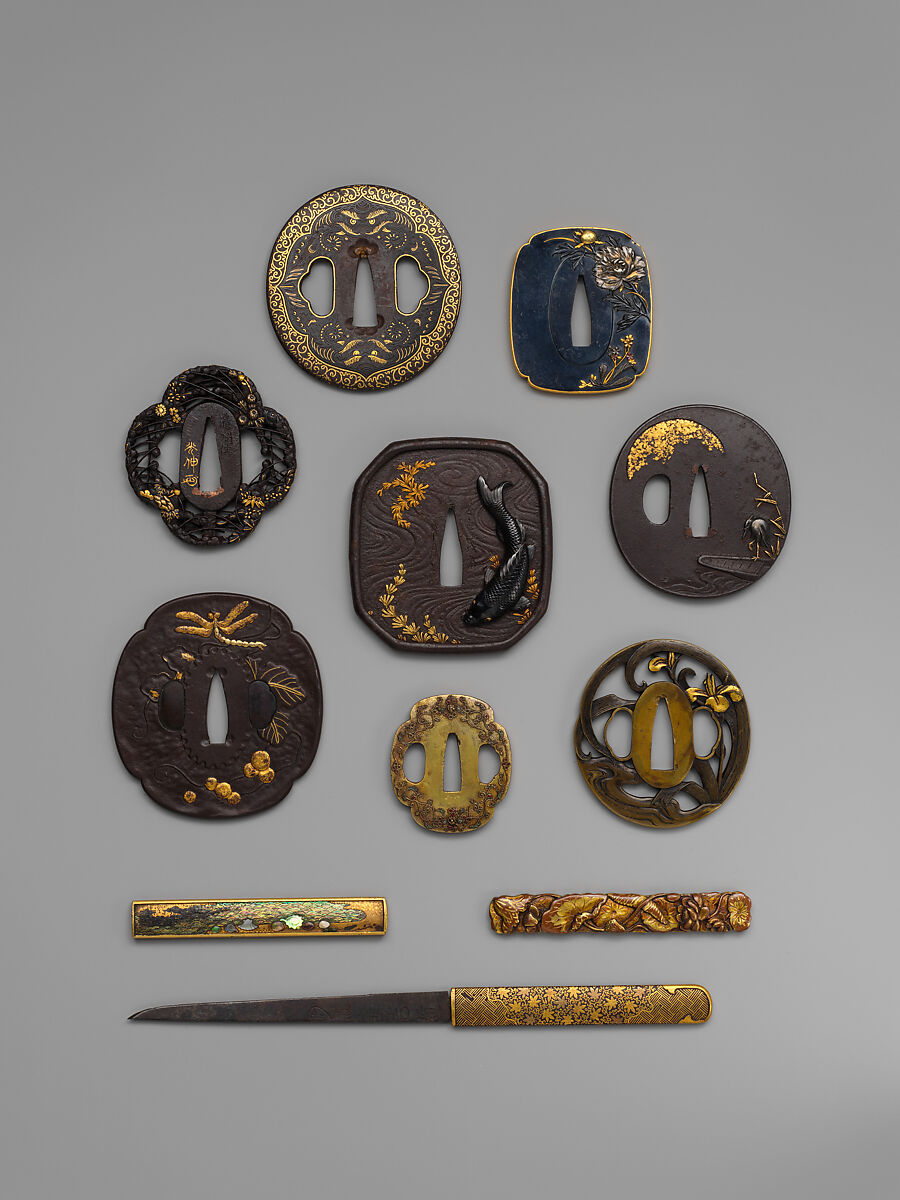 Sword Guard (<i>Tsuba</i>) Depicting Biting Lion Heads (<i>Shikami</i>) and Arabesques (獅噛唐草図南蛮鐔), Iron, gold, copper-gold alloy (<i>shakudō</i>), Japanese