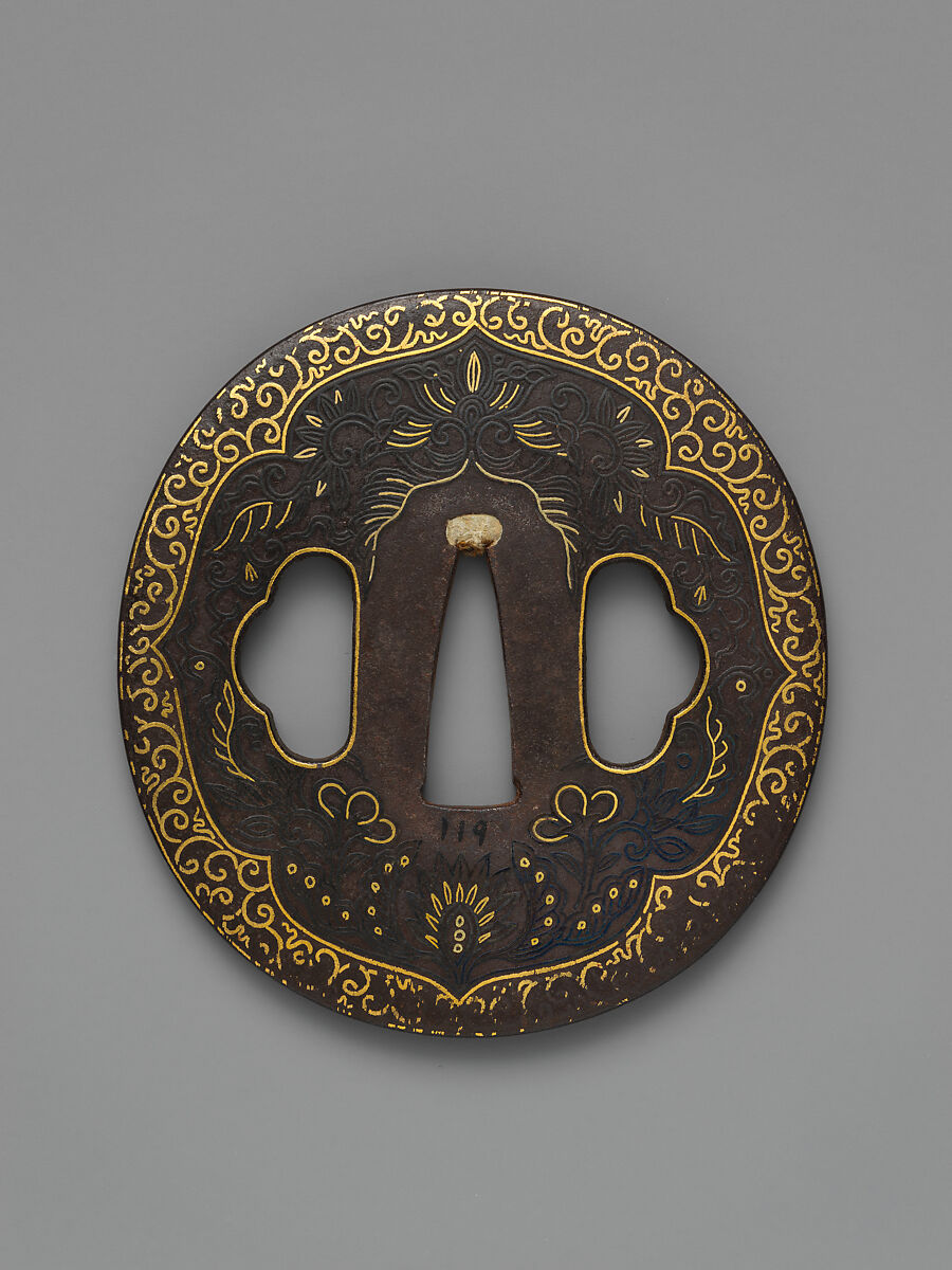 Sword Guard (<i>Tsuba</i>) Depicting Biting Lion Heads (<i>Shikami</i>) and Arabesques (獅噛唐草図南蛮鐔), Iron, gold, copper-gold alloy (<i>shakudō</i>), Japanese