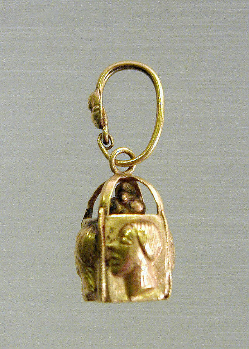 Pair of gold earrings with four relief faces, Gold, Phoenician