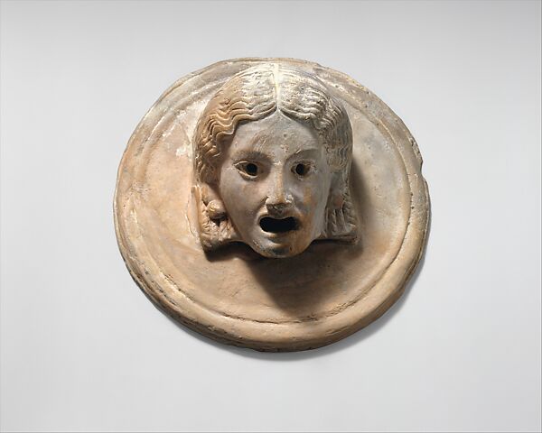 Two terracotta roundels with theatrical masks, Terracotta, Greek