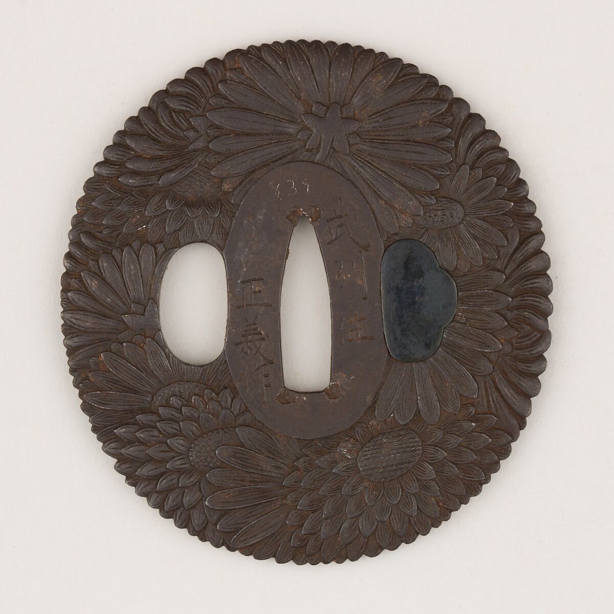 Sword guard (<i>Tsuba</i>) With Chrysanthemum Motif (菊花図鐔), Masayoshi (Japanese, active late 18th century), Iron, copper-gold alloy (shakudō), Japanese 