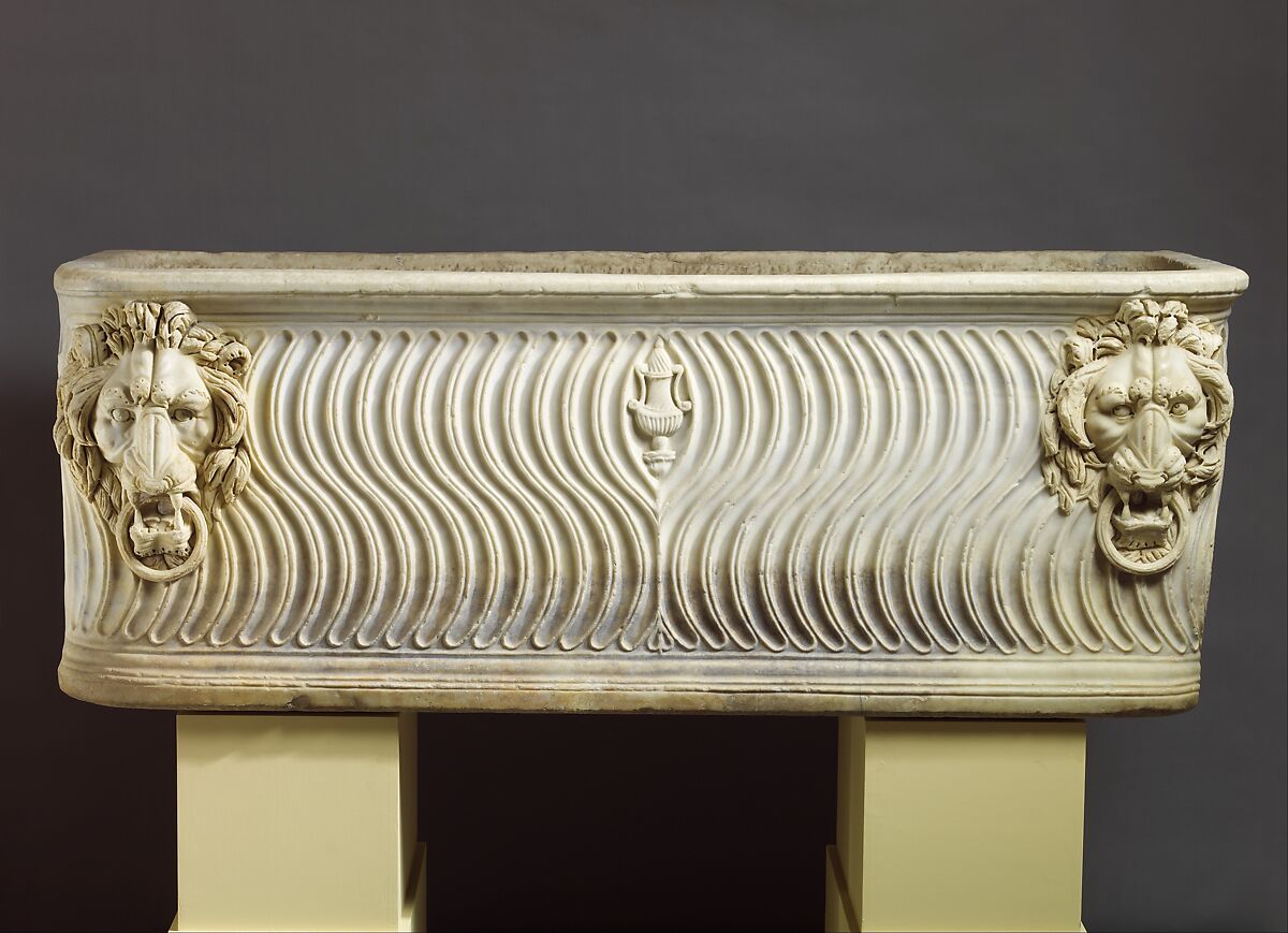 Marble strigilated sarcophagus