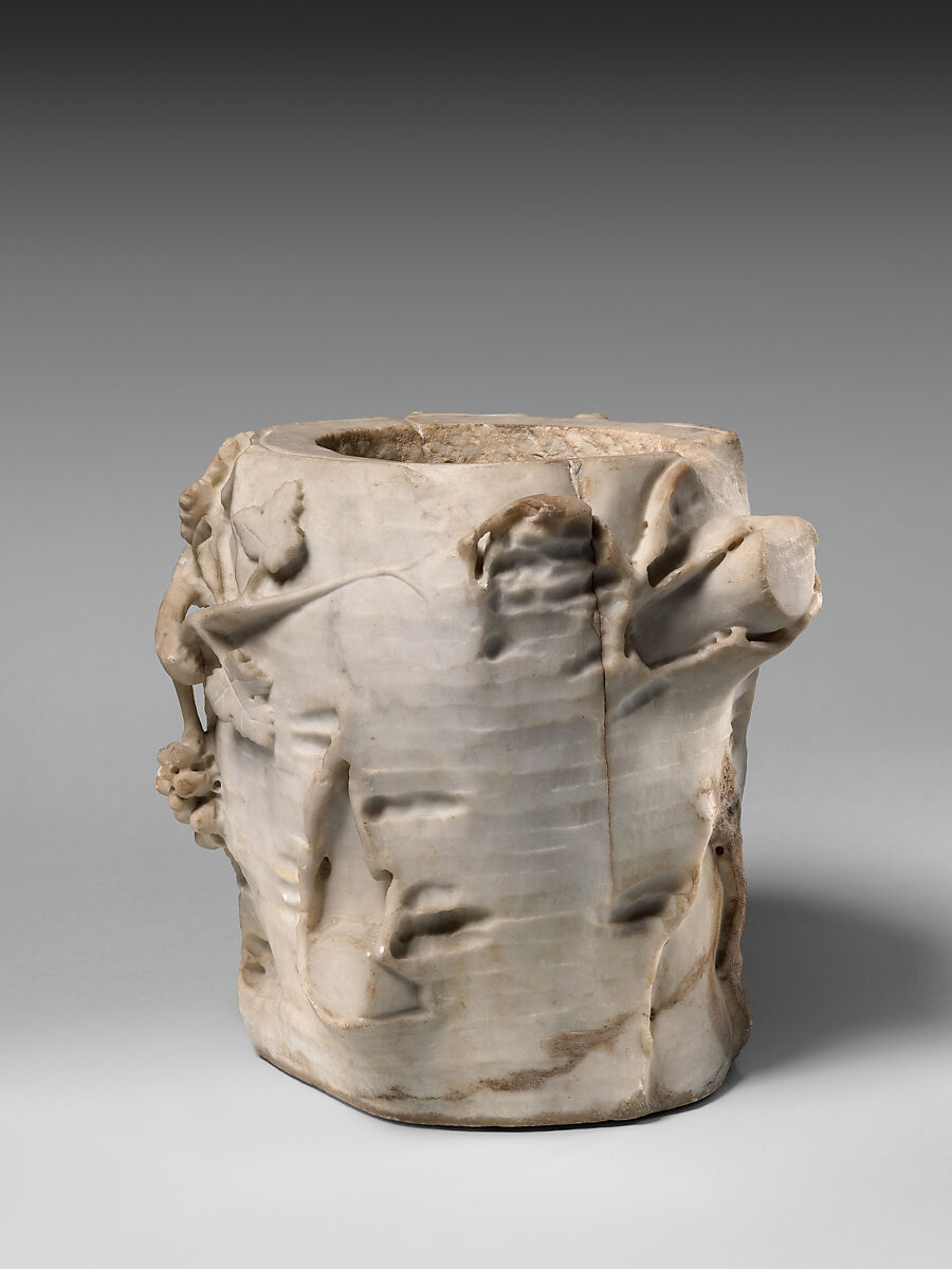 Marble cinerary urn in the form of a tree stump with leaves and grapes, Marble, Roman