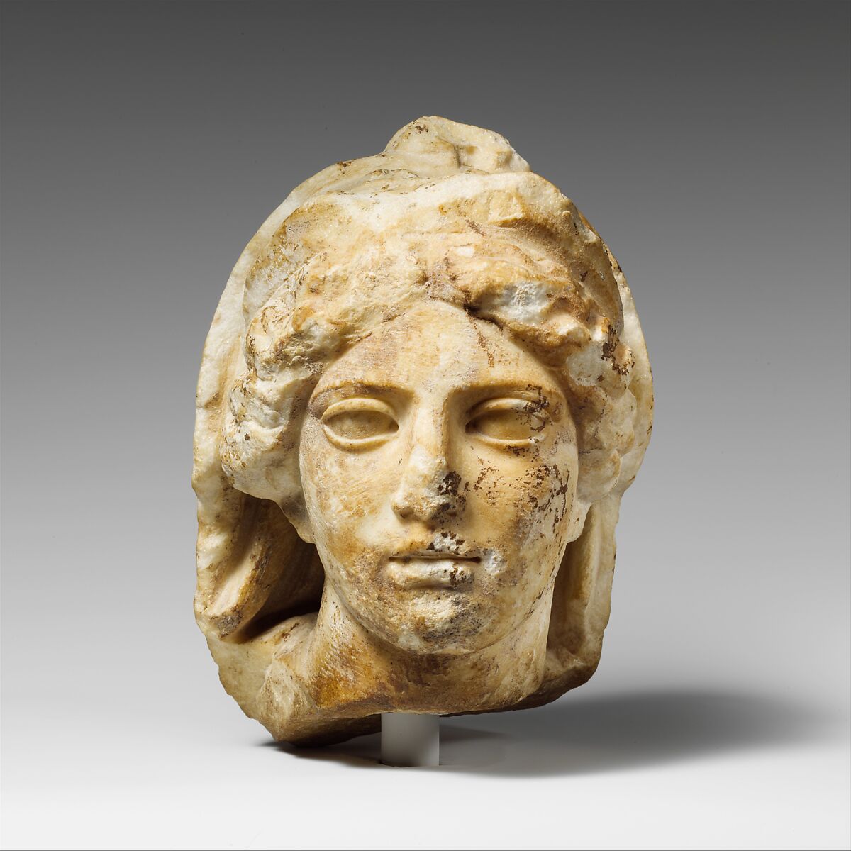 Marble head of a woman wearing diadem and veil