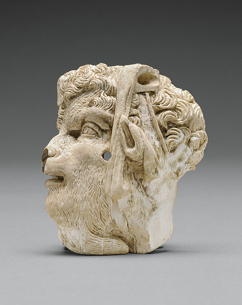 Applique depicting the head of Pan, Ivory, Greek 
