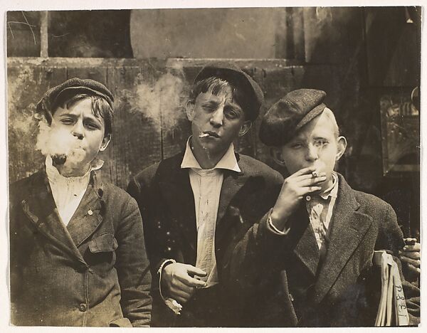 11:00 A.M. Monday, May 9th, 1910. Newsies at Skeeter's Branch, Jefferson near Franklin. They were all smoking. Location: St. Louis, Missouri.
