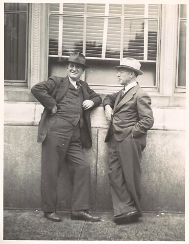 [Two Businessmen in Hats Talking on Street, Florida]