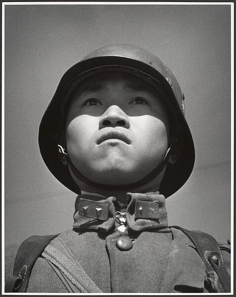 A fifteen-year-old stands at attention before his company leaves for the front and the decisive Sino-Japanese battles of the year. Hankow, March, Robert Capa  American, born Hungary, Gelatin silver print