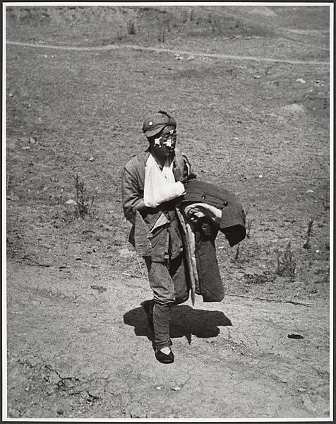 A wounded soldier treks six miles to a hospital behind the front lines after the Chinese victory at Taierhchwang, April, Robert Capa  American, born Hungary, Gelatin silver print
