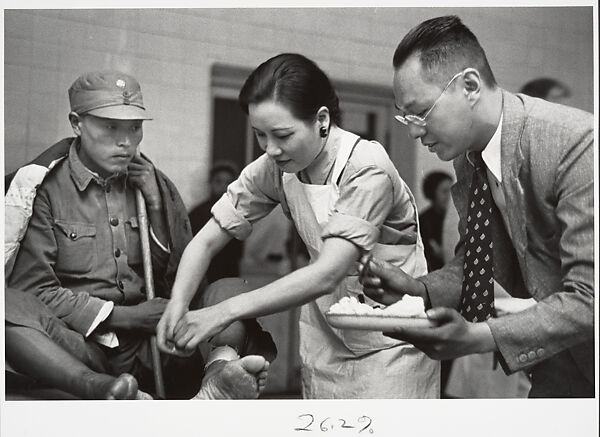 Mme. Chaing Kai-shek caring for the wounded. Hankow, Robert Capa  American, born Hungary, Gelatin silver print