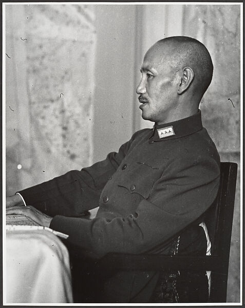 Chaing Kai-shek presides over his Supreme War Council just prior to the departure of the twenty-eight German advisors who had been instrumental in training his army. Hankow, July 4, Robert Capa  American, born Hungary, Gelatin silver print