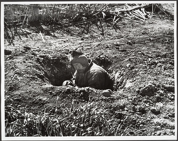His own garden provides this man with an air raid shelter, Hankow, Robert Capa (American (born Hungary), Budapest 1913–1954 Thai Binh), Gelatin silver print 