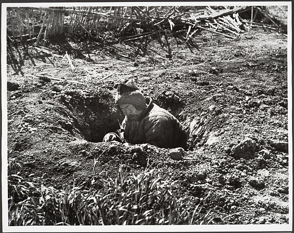 His own garden provides this man with an air raid shelter, Hankow, Robert Capa  American, born Hungary, Gelatin silver print