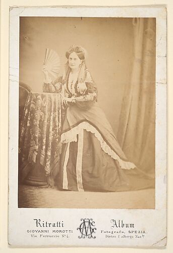 [La Comtesse at Table Holding Fan]