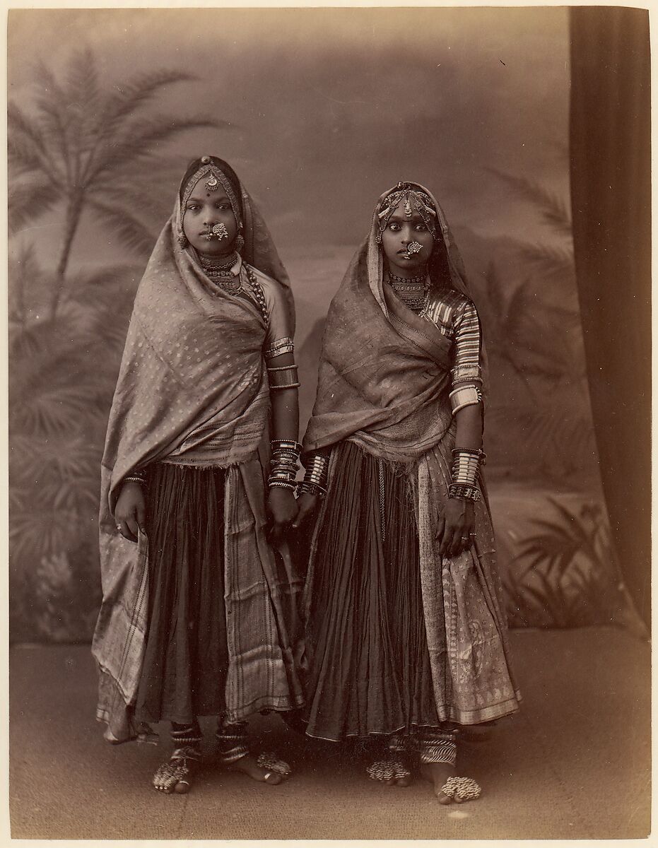 [Two Hindu Women in Elaborate Jewelry, Before Studio Backdrop with Palm Trees], Unknown, Albumen silver print from glass negative 
