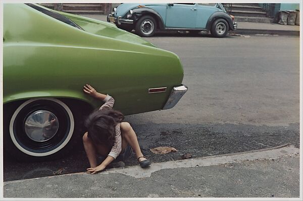 [Girl Playing Under Green Car, New York City], Helen Levitt (American, 1913–2009), Dye transfer print 