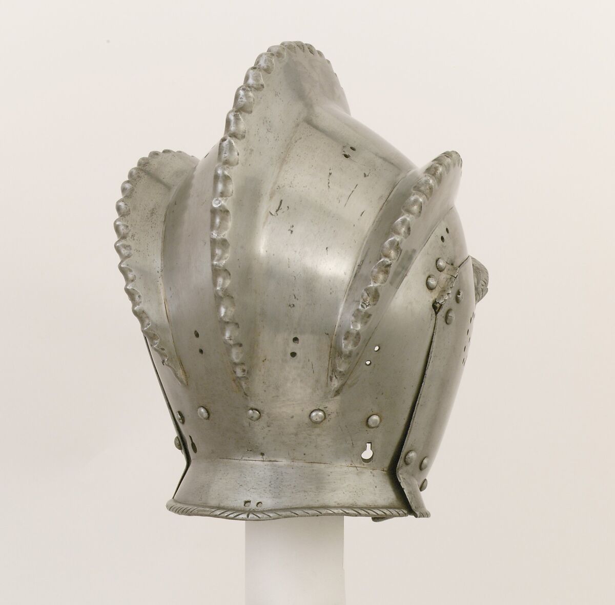Burgonet, Replacement cheek-pieces made by Leonard Heinrich (American (born Germany) Munich 1900–1966 Clarksville, New Jersey)  ,  in The Metropolitan Museum of Art, Armor Workshop, Steel, leather, German, Augsburg