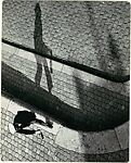 [Pedestrian with a Bottle in Hand, Viewed from Above]