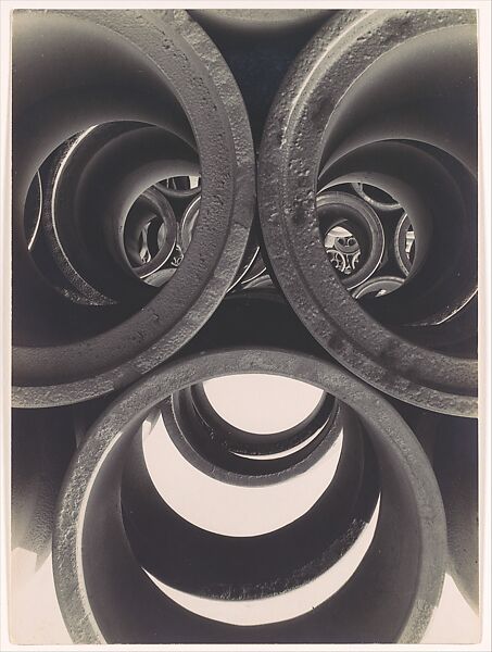 [Water Pipe Abstraction; View through Circular Ends of 3 Stacked Pipes onto Rows of Stacked Pipes in Background], Brett Weston (American, Los Angeles, California 1911–1993 Kona, Hawaii), Gelatin silver print 