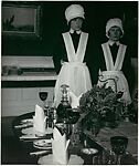 Parlourmaid and Under-Parlourmaid Ready to Serve Dinner