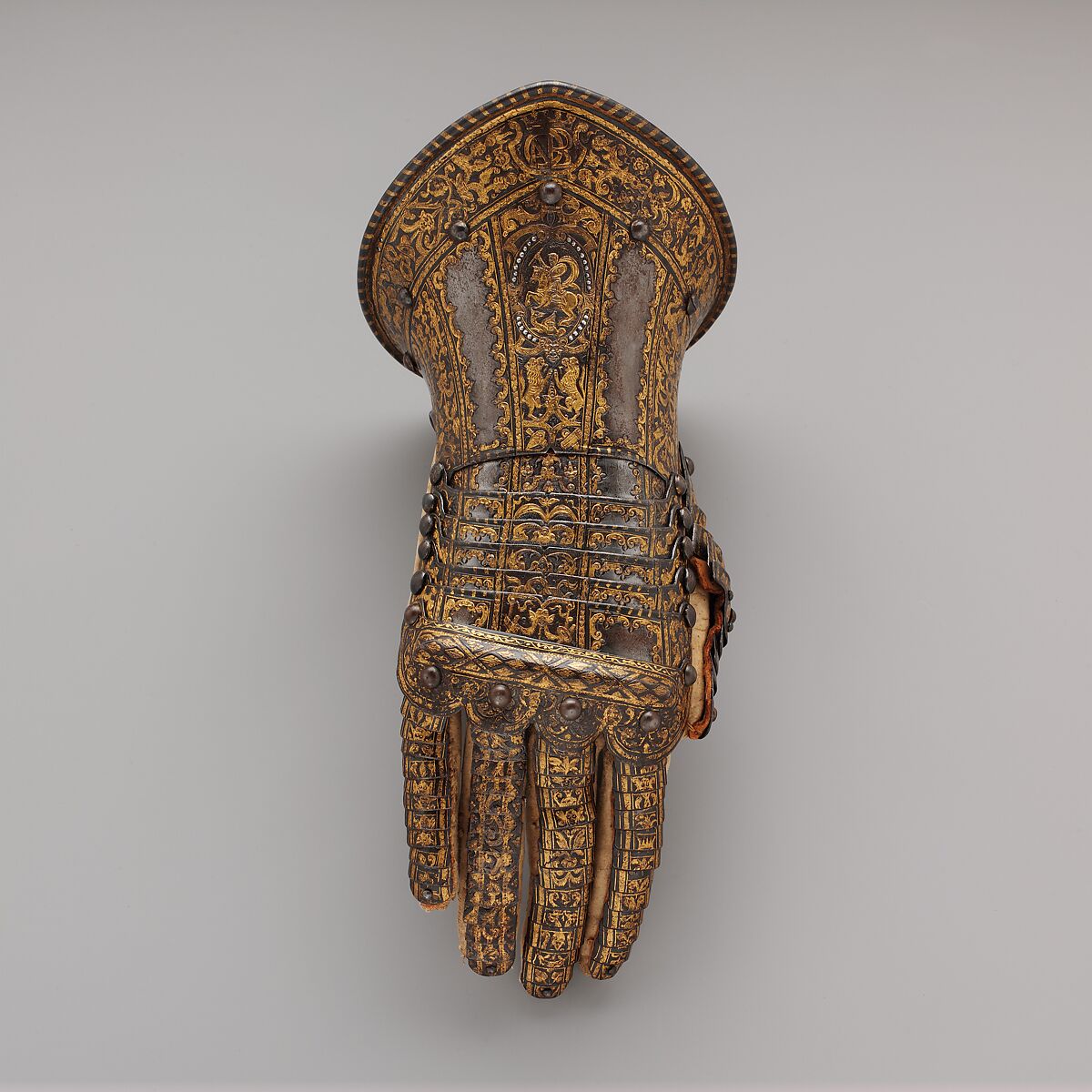 Gauntlet for the Right Hand, Belonging to the Armor of Don Alonzo Pérez de Guzman el Bueno (1550–1619), Count of Niebla and Duke of Medina-Sidonia, Steel, silver, gold, textile, leather, Italian, Milan