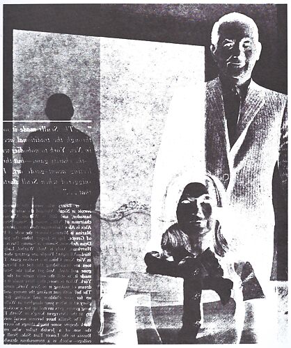 [Man in Suit Standing Behing Seated Woman in Suit]